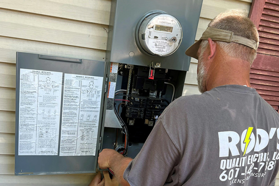 man fixing electric panel